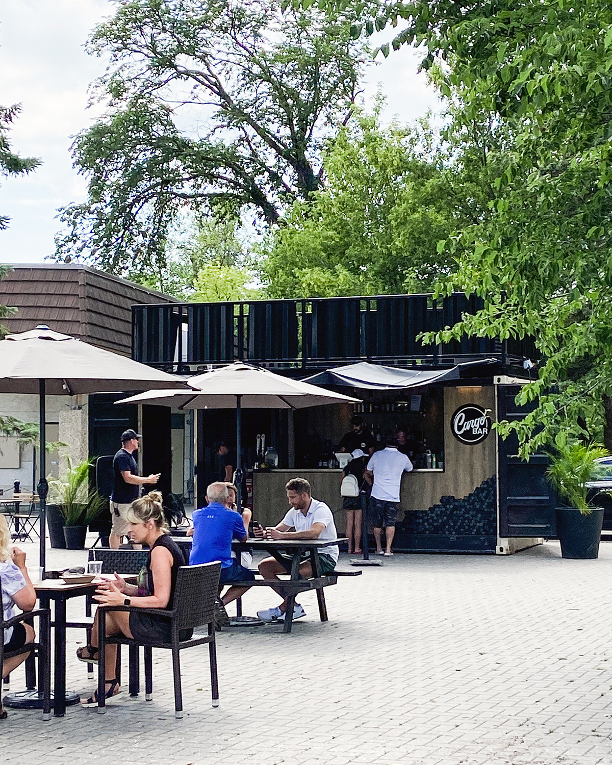 people sitting at the outdoor Cargo Bar patio